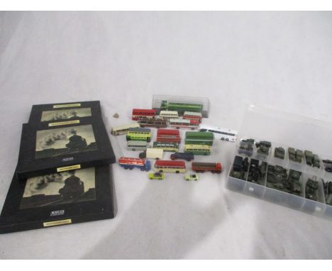 A collection of N gauge and 1/220 scale vehicles including Atlas Minitrains, Oxford and other buses, Military vehicles, truck