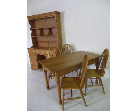 An Old Charm light oak dining suite consisting of dresser, table and four Windsor chairs