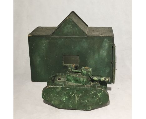 A handmade wooden army tank and matching garage