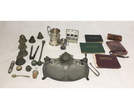 A collection of interesting items including a miniature tin containing a seal, autograph albums, pewter Art Nouveau inkwell (