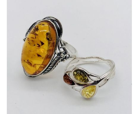 A 925 silver and amber ring along with one other