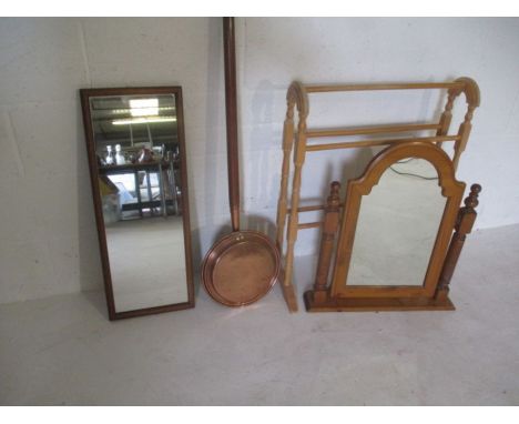 A toilet mirror plus one other, a towel rail and a copper bed warming pan. 