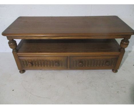 An Ercol "Golden Dawn" TV cabinet/coffee table with two drawers