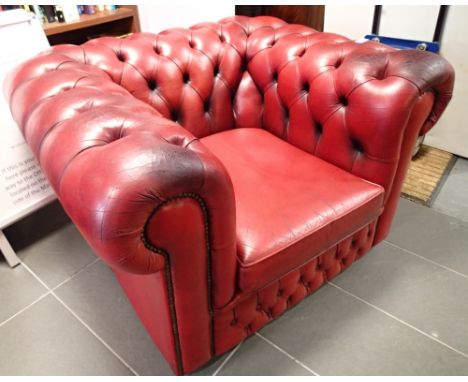 Red leather button back club chair 