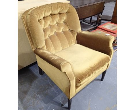 Vintage button back armchair on reeded supports 