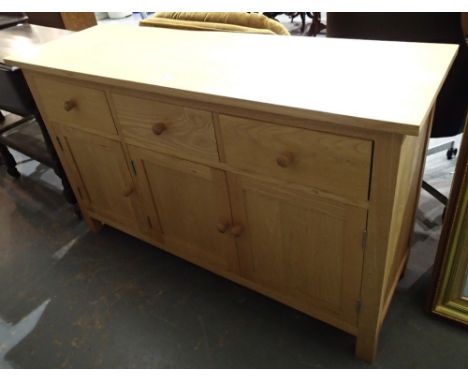 Light oak sideboard with 3 drawers over three cupboards 132 x 43 x 79 cm H