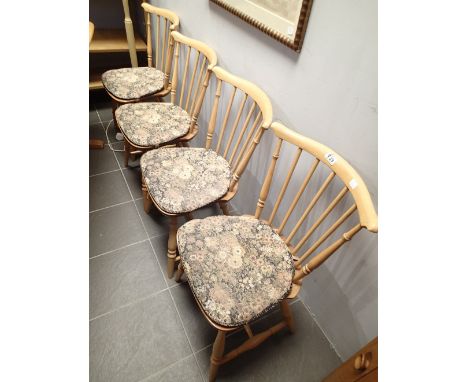 Set of four Ercol elm seated stick back dining chairs with cushions 