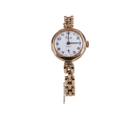 LADY'S PRESISTA NINE CARAT GOLD MANUAL WIND WRIST WATCH,the round white dial with applied Arabic hour markers, outer seconds 