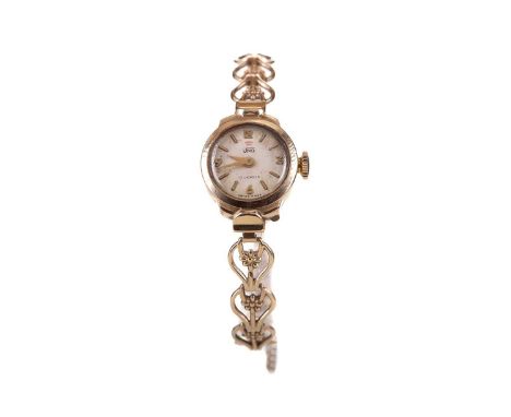 LADY'S UNO NINE CARAT GOLD MANUAL WIND WRIST WATCH,the round cream dial with applied baton and Arabic hour markers, 16mm case