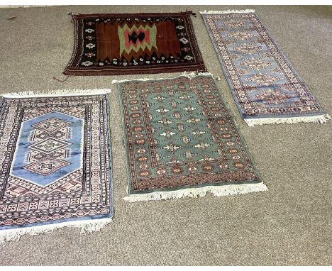 A small modern runner, with six guls on a light blue ground, 190cm long; also three other small rugs (4)