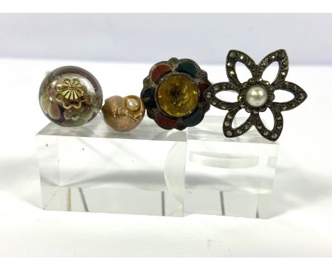 An attractive vintage yellow metal hat pin, the terminal in the form of a Conch shell, concealing a small pearl, with steel p