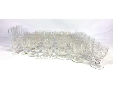 A large assortment of table glassware, including a table lamp base, decanter; a selection of Stuart crystal wine glasses and 