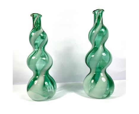 A pair of Empoli Region vintage glass &rdquo;Genie&rsquo; bottles, circa 1970, with white and green striated and globular bod