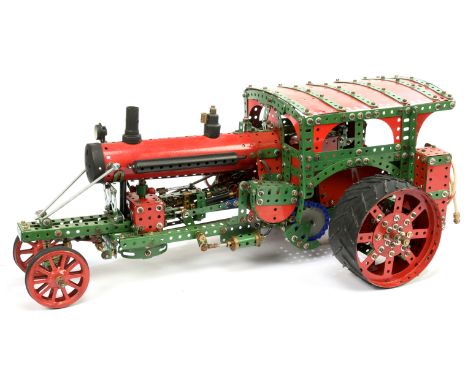Meccano hand built Traction or similar model engine using red and green Meccano parts, electric motor, internal cylinders, st