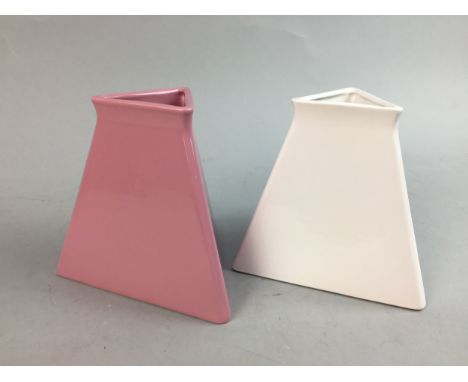 TWO TRIANGULAR POTTERY VASES, comprising one pink and one white, each 15cm high, along with three tall vases, a circular red 