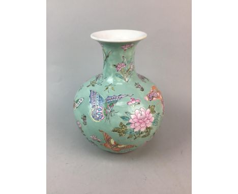 20TH CENTURY CHINESE VASE, with floral and butterfly motif decoration on a blue ground, with marks to underside, 27cm high, a