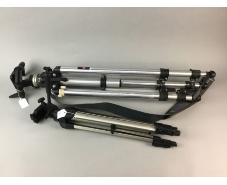 TWO TRIPOD CAMERA STANDS, along with accessories