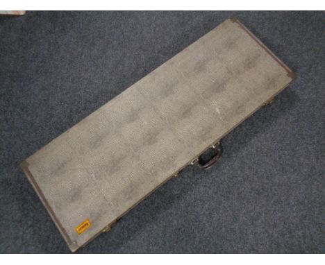 A vintage Selmer instrument case lined with red velvet 