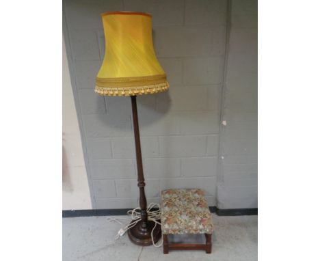 A beech standard lamp with shade together with a tapestry upholstered foot stool.
