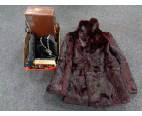 A faux fur coat together with a box containing assorted leather handbags, vintage case