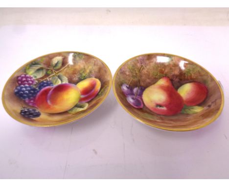 Two Royal Worcester gilt-rimmed small circular dishes, with hand painted Fruit decoration, each indistinctly signed (differen
