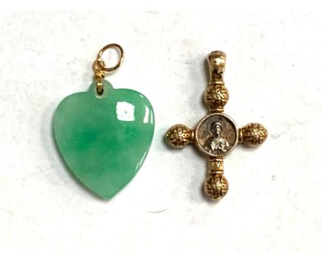 A gold mounted jade heart pendant together with a yellow metal cross