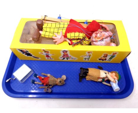 A tray containing mid 20th century Rupert the Bear Pelham puppet together with two further clockwork toys; Mickey Mouse and a