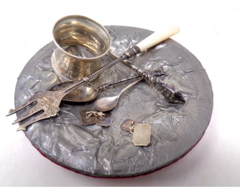 A small collection of silver to include a pronged pickle fork, handled button hook, teaspoon and mustard spoon, pair of silve