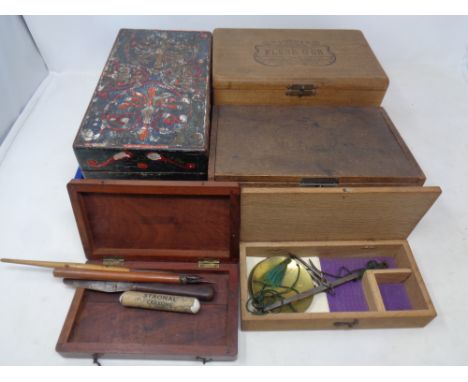 A tray containing antique and later wooden boxes, cigar boxes, cased opium scales.
