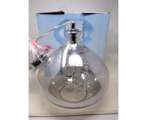 A crystal encased pendant light fitting. Boxed as new