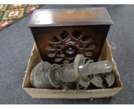 A box containing an early 20th century Amplion Cone speaker together with an oil lamp with glass chimney and a further paraff