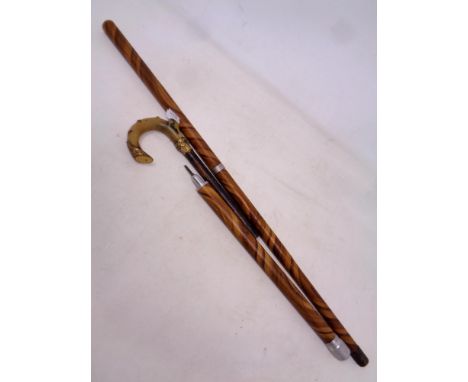 An early 20th century sectional walking stick with internal fountain pen and pencil. Formerly the property of Thomas H Bone, 