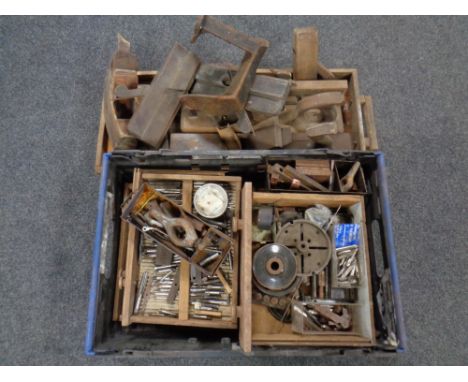 A wooden tray and a crate containing a large quantity of wooden joinery tools, cobbler's last, tap and die pieces