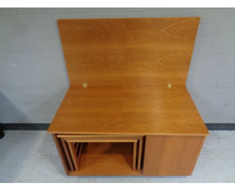 A mid 20th century teak Mcintosh furniture Tristor turn over top coffee table fitted nest of two tables beneath and drinks ca