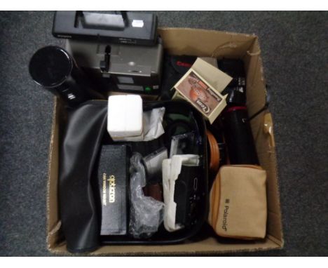 A box containing Zeiss projector, camera equipment, cameras, lenses cases,  etc