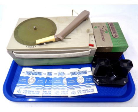 A tray containing a mid 20th century Stella portable record player together with a boxed Viewmaster stereoscope with reels 