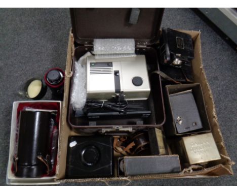 A box containing a large quantity of camera equipment to include Sunzoom lense projector, Campro cine camera projector in cas