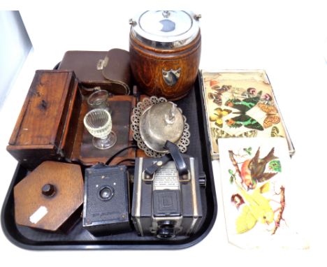 A tray containing miscellany to include an Edwardian oak and silver plated biscuit barrel, wooden trinket box, pipe rack, vin