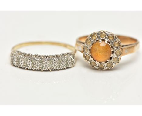 TWO GEM SET RINGS, the first a cluster ring set with a central, circular cut orange stone in a surround of colourless spinels