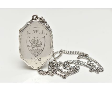 A SILVER VINAIGERETTE PENDANT, lozenge form with scalloped edges, engraved with foliage detail to the front, the obverse engr