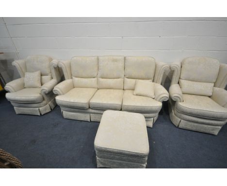 A FLORAL AND GOLD UPHOLSTERED FOUR PIECE LOUNGE SUITE, comprising a three seater sofa, length 206cm, a pair of armchairs, and