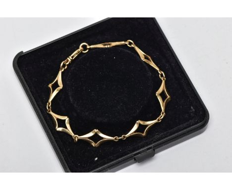 A 9CT GOLD FANCY LINK BRACELET, designed with a series of openwork diamond shape links, with jump ring spacers, fitted with a