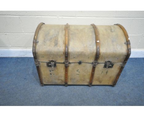A VINTAGE WOODEN AND CANVAS DOMED TOP TRUNK, with leather straps, width 88cm x depth 56cm x height 64cm (condition:-missing i