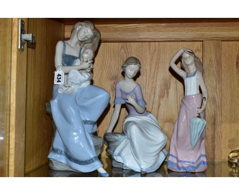 THREE NAO FIGURES, comprising My Little Girl no 1297, Spring Reflections no 1392, and Girl with Parasol no 1294, height of ta