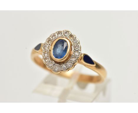 A 14CT GOLD, SAPPHIRE AND DIAMOND CLUSTER RING, of an oval form, centrally set with an oval cut mid blue sapphire, collet set