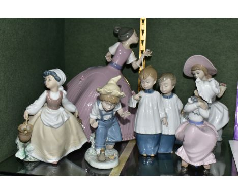 A GROUP OF LLADRO AND NAO FIGURES, to include a Lladro Girl in Pink Dress model no 5120, sculptor Jose Puche, issued 1982-198