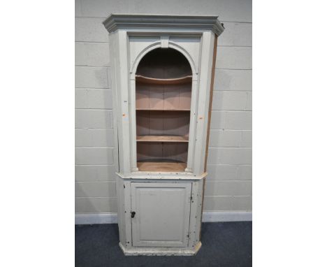 A 19TH CENTURY PAINTED PINE BARREL BACK CORNER CUPBOARD, with three open shelves, over a single fielded panel door, width 93c