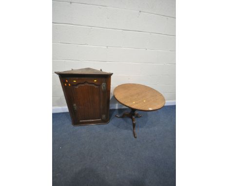 A GEORGIAN MAHOGANY CIRCULAR TILT TOP TRIPOD TABLE, diameter 80cm x height 70cm, and a Georgian oak fielded panel hanging cor