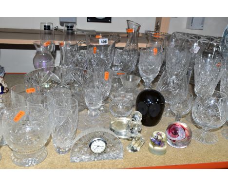 A GROUP OF CUT CRYSTAL,  comprising an Edinburgh Crystal miniature mantel clock, a Whitefriars Twilight Glass Owl, a pair of 