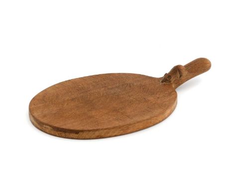 Workshop of Robert Mouseman Thompson (Kilburn): An English Oak Cheese Board, post 1960, of standard form, with carved mouse t